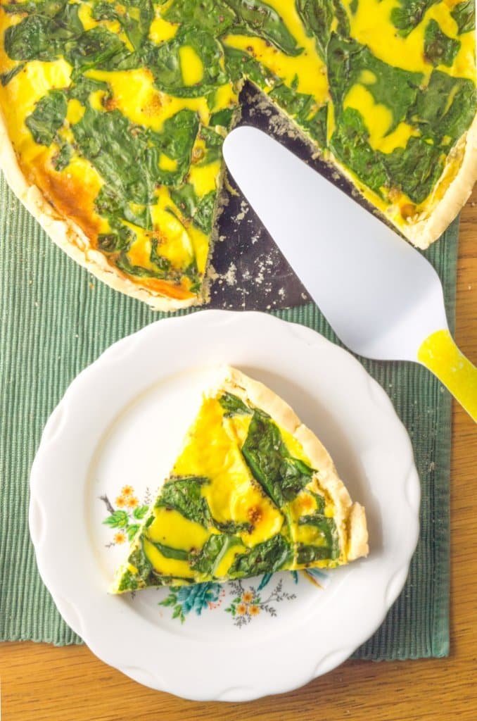 slice and spinach and cheese quiche, side by side
